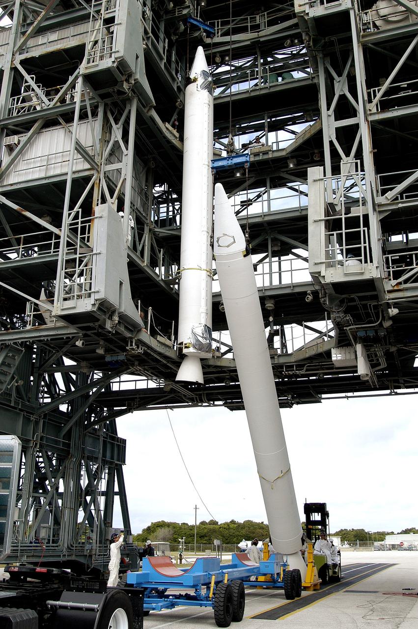 KENNEDY SPACE CENTER, FLA. - Another solid rocket booster is raised to vertical on Launch Complex 17-B, Cape Canaveral Air Force Station.  It is the second of nine SRBs that will be mated to the Delta II rocket for the Mars Exploration Rover 1 (MER-1) launch June 25.  NASA’s twin Mars Exploration Rovers are designed to study the history of water on Mars. These robotic geologists are equipped with a robotic arm, a drilling tool, three spectrometers, and four pairs of cameras that allow them to have a human-like, 3D view of the terrain. Each rover could travel as far as 100 meters in one day to act as Mars scientists' eyes and hands, exploring an environment where humans can’t yet go.  MER-2 (MER-A) will launch June 5.