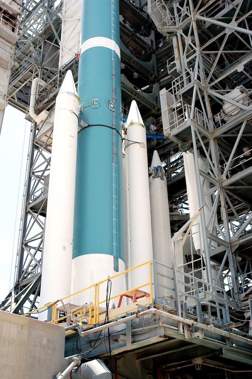 KENNEDY SPACE CENTER, FLA. - On the launch tower of Launch Complex 17-B, Cape Canaveral Air Force Station, solid rocket boosters are mated to the Delta II rocket for the Mars Exploration Rover 1 (MER-1) launch June 25.  NASA’s twin Mars Exploration Rovers are designed to study the history of water on Mars. These robotic geologists are equipped with a robotic arm, a drilling tool, three spectrometers, and four pairs of cameras that allow them to have a human-like, 3D view of the terrain. Each rover could travel as far as 100 meters in one day to act as Mars scientists' eyes and hands, exploring an environment where humans can’t yet go.  MER-2 (MER-A) will launch June 5.