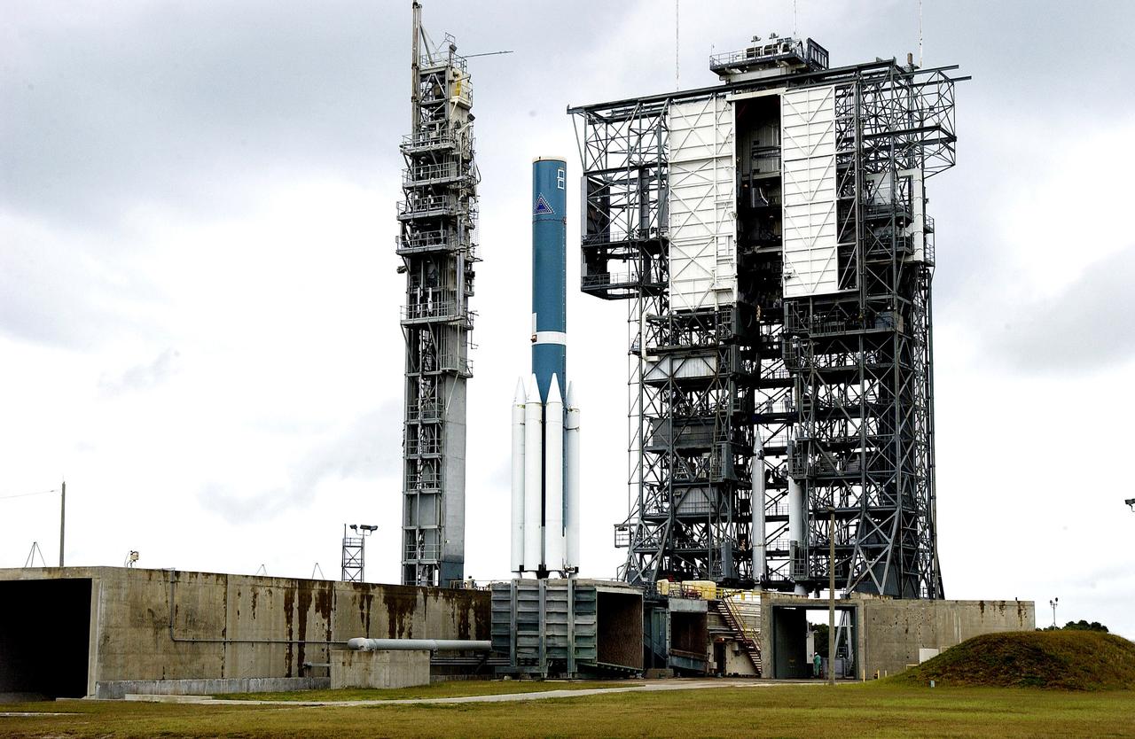 KENNEDY SPACE CENTER, FLA. -  Solid rocket boosters are positioned around the base of a Delta II rocket for the Mars Exploration Rover 1 (MER-1) launch on June 25 at Launch Complex 17-B, Cape Canaveral Air Force Station.  NASA’s twin Mars Exploration Rovers are designed to study the history of water on Mars. These robotic geologists are equipped with a robotic arm, a drilling tool, three spectrometers, and four pairs of cameras that allow them to have a human-like, 3D view of the terrain. Each rover could travel as far as 100 meters in one day to act as Mars scientists' eyes and hands, exploring an environment where humans can’t yet go.  MER-2 (MER-A) will launch June 5.