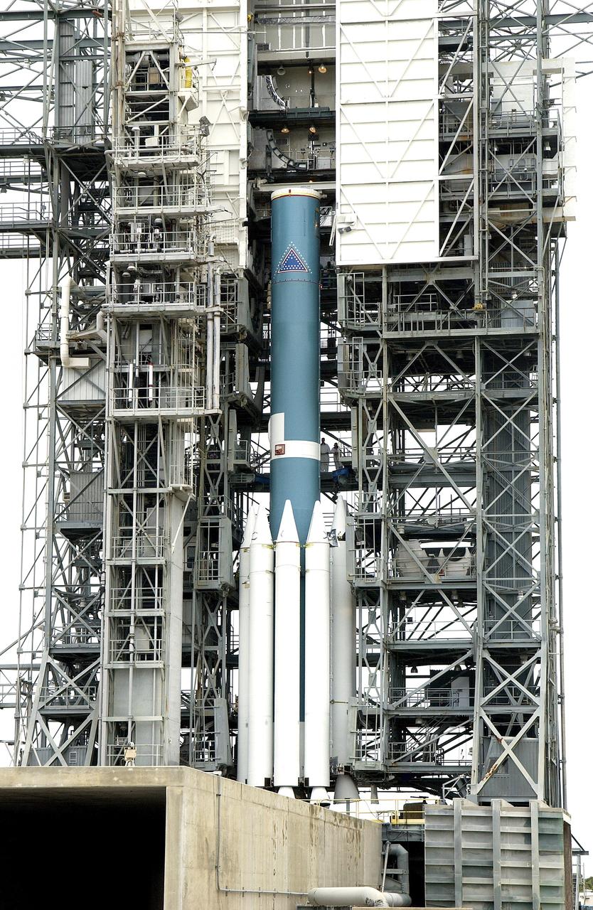 KENNEDY SPACE CENTER, FLA. -  Solid rocket boosters are attached to the base of a Delta II rocket for the Mars Exploration Rover 1 (MER-1) launch on June 25 at Launch Complex 17-B, Cape Canaveral Air Force Station.  NASA’s twin Mars Exploration Rovers are designed to study the history of water on Mars. These robotic geologists are equipped with a robotic arm, a drilling tool, three spectrometers, and four pairs of cameras that allow them to have a human-like, 3D view of the terrain. Each rover could travel as far as 100 meters in one day to act as Mars scientists' eyes and hands, exploring an environment where humans can’t yet go.  MER-2 (MER-A) will launch June 5.