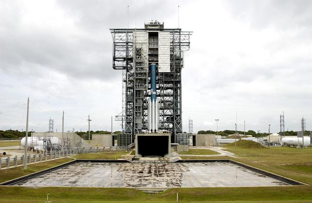 NASA image: KENNEDY SPACE CENTER, FLA. -  Erection of the Delta II rocket for the Mars Exploration Rover 1 (MER-1) launch on June 25 at Launch Complex 17-B, Cape Canaveral Air Force Station, is under way.  NASA’s twin Mars Exploration Rovers are designed to study the history of water on Mars. These robotic geologists are equipped with a robotic arm, a drilling tool, three spectrometers, and four pairs of cameras that allow them to have a human-like, 3D view of the terrain. Each rover could travel as far as 100 meters in one day to act as Mars scientists' eyes and hands, exploring an environment where humans can’t yet go.  MER-2 (MER-A) will launch June 5.