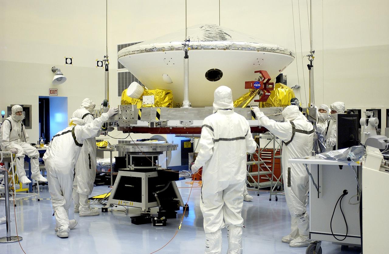 KENNEDY SPACE CENTER, FLA. -  In the Payload Hazardous Servicing Facility, workers prepare to mate the Mars Exploration Rover-2 (MER-2) to the third stage of a Delta II rocket for launch on June 5.  NASA’s twin Mars Exploration Rovers are designed to study the history of water on Mars. These robotic geologists are equipped with a robotic arm, a drilling tool, three spectrometers, and four pairs of cameras that allow them to have a human-like, 3D view of the terrain. Each rover could travel as far as 100 meters in one day to act as Mars scientists' eyes and hands, exploring an environment where humans can’t yet go.  MER-1 (MER-B) will launch June 25.
