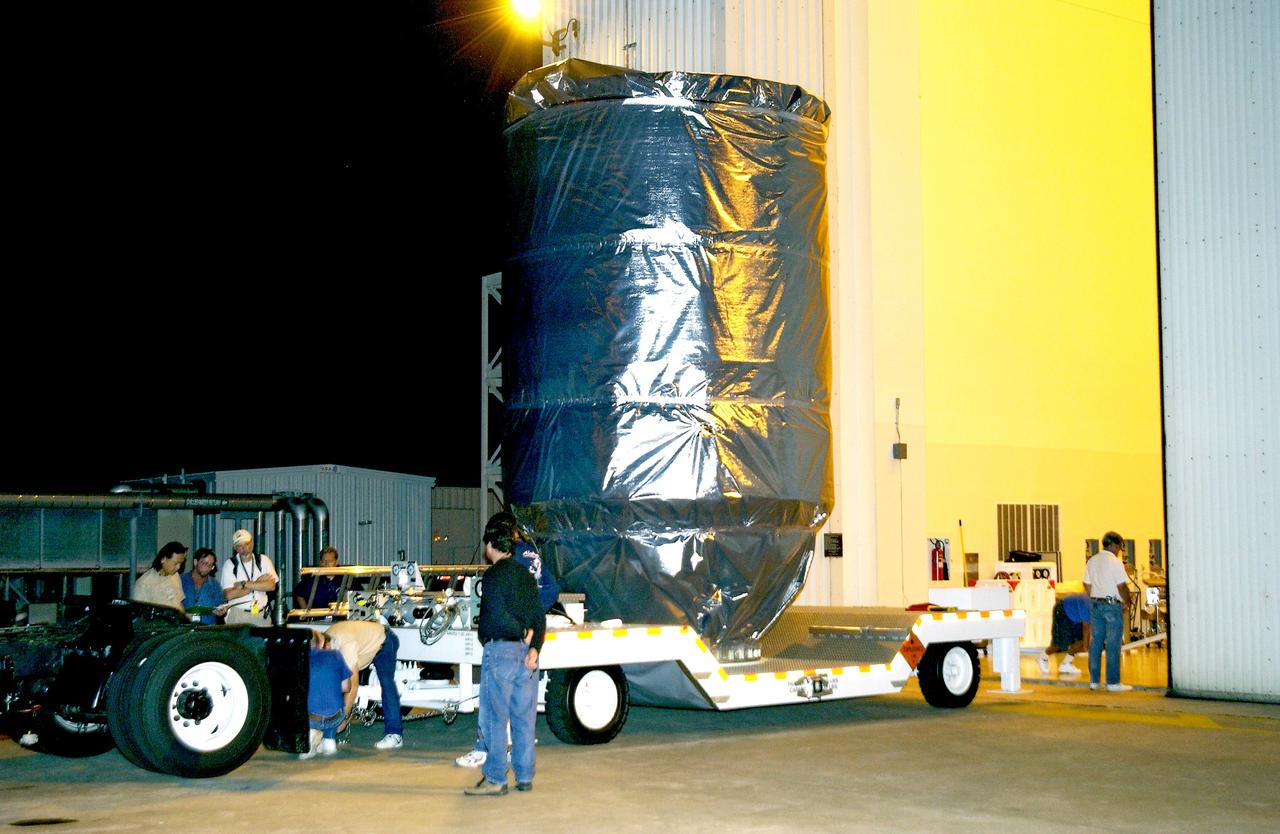 KENNEDY SPACE CENTER, FLA. - The Mars Exploration Rover 2 (MER-2), inside the transport canister, is ready for transfer to Launch Pad 17-A, Cape Canaveral Air Force Station.  At the pad it will be mated to the Delta II rocket for launch.  MER-2 is one of NASA's twin Mars Exploration Rovers designed to study the history of water on Mars. These robotic geologists are equipped with a robotic arm, a drilling tool, three spectrometers, and four pairs of cameras that allow them to have a human-like, 3D view of the terrain. Each rover could travel as far as 100 meters in one day to act as Mars scientists' eyes and hands, exploring an environment where humans can't yet go.  MER-2 is scheduled to launch no earlier than June 8 as MER-A.