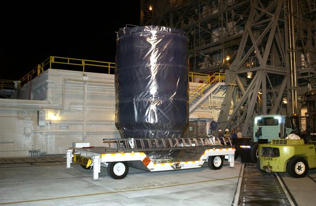 NASA image: KENNEDY SPACE CENTER, FLA. - The Mars Exploration Rover 2 (MER-2), inside the transport canister, has arrived at Launch Pad 17-A, Cape Canaveral Air Force Station, where it will be mated to the Delta II rocket for launch.  MER-2 is one of NASA's twin Mars Exploration Rovers designed to study the history of water on Mars. These robotic geologists are equipped with a robotic arm, a drilling tool, three spectrometers, and four pairs of cameras that allow them to have a human-like, 3D view of the terrain. Each rover could travel as far as 100 meters in one day to act as Mars scientists' eyes and hands, exploring an environment where humans can't yet go.  MER-2 is scheduled to launch no earlier than June 8 as MER-A.
