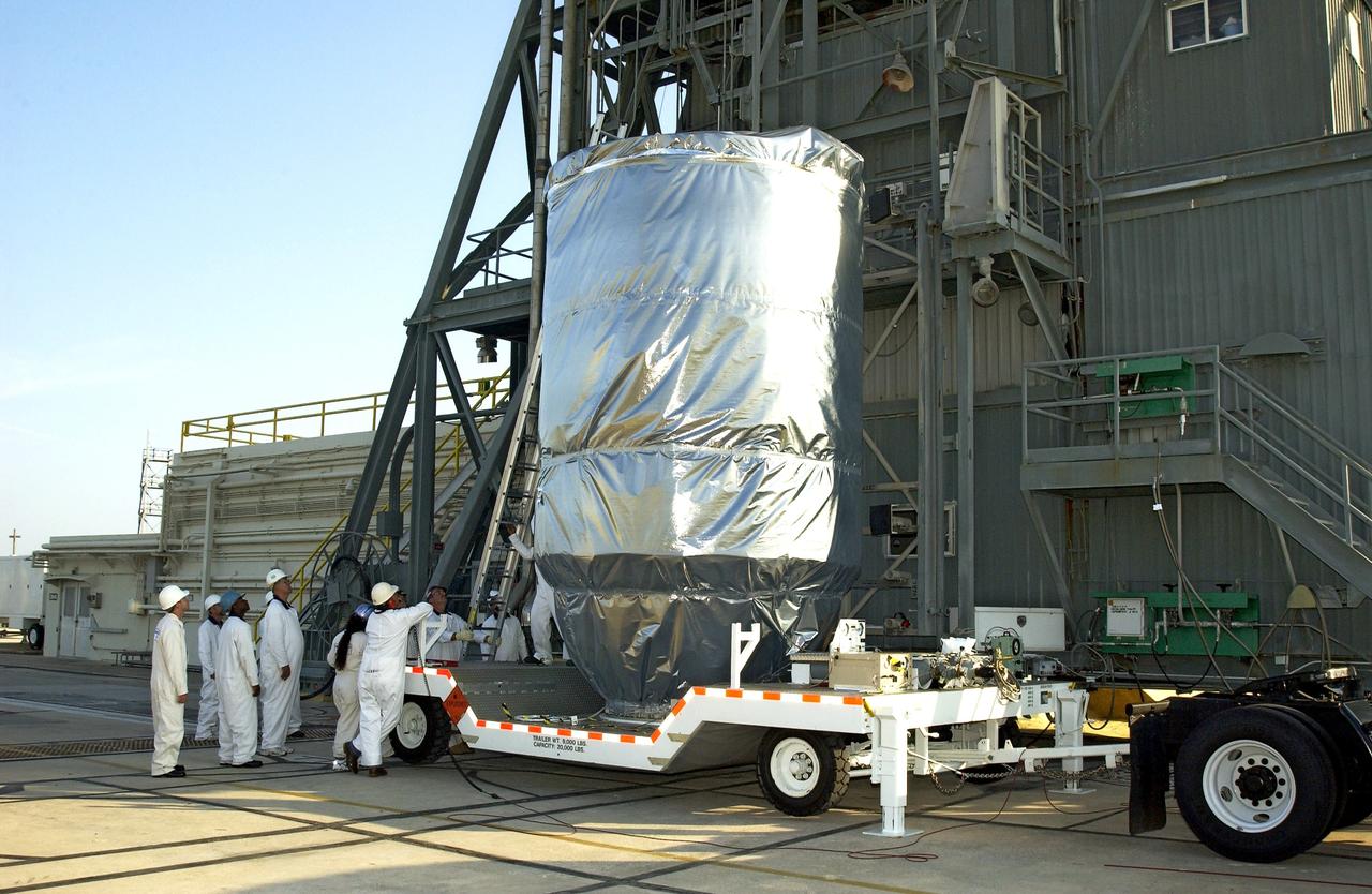 KENNEDY SPACE CENTER, FLA. - The Mars Exploration Rover 2 (MER-2), inside the transport canister, will be lifted up the launch tower on Launch Pad 17-A, Cape Canaveral Air Force Station, where it will be mated to the Delta II rocket for launch.  MER-2 is one of NASA's twin Mars Exploration Rovers designed to study the history of water on Mars. These robotic geologists are equipped with a robotic arm, a drilling tool, three spectrometers, and four pairs of cameras that allow them to have a human-like, 3D view of the terrain. Each rover could travel as far as 100 meters in one day to act as Mars scientists' eyes and hands, exploring an environment where humans can't yet go.  MER-2 is scheduled to launch no earlier than June 8 as MER-A.
