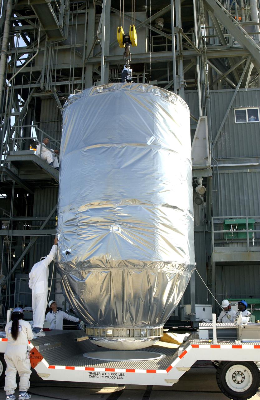 KENNEDY SPACE CENTER, FLA. - On Launch Pad 17-A, Cape Canaveral Air Force Station, the Mars Exploration Rover 2 (MER-2), inside the transport canister, is ready to be lifted into the launch tower where it will be mated to the Delta II rocket for launch.  MER-2 is one of NASA's twin Mars Exploration Rovers designed to study the history of water on Mars. These robotic geologists are equipped with a robotic arm, a drilling tool, three spectrometers, and four pairs of cameras that allow them to have a human-like, 3D view of the terrain. Each rover could travel as far as 100 meters in one day to act as Mars scientists' eyes and hands, exploring an environment where humans can't yet go.  MER-2 is scheduled to launch no earlier than June 8 as MER-A.