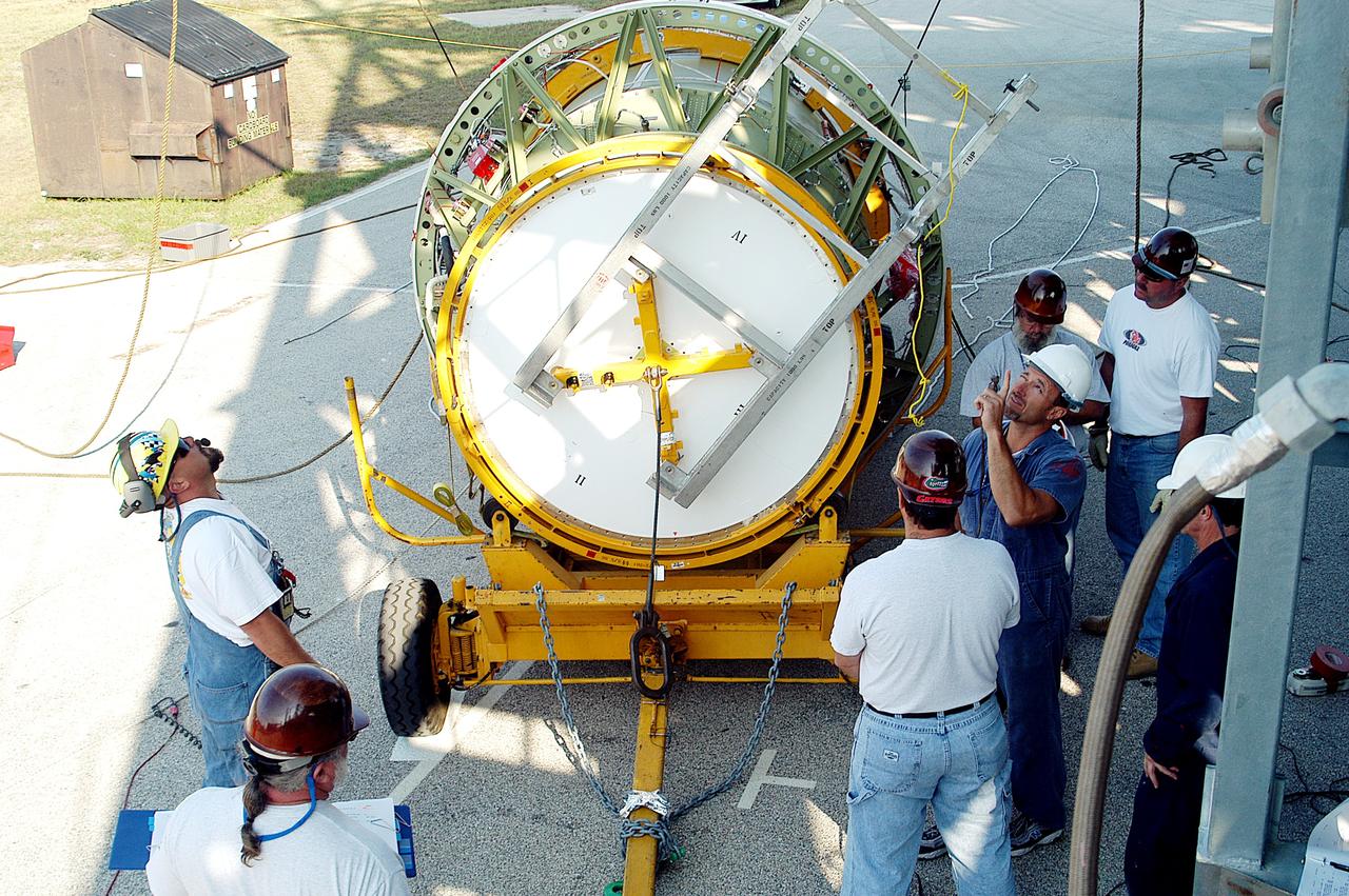 KENNEDY SPACE CENTER, FLA. - The second stage of a Delta II rocket is prepared for lifting up the launch tower on Pad 17-B, Cape Canaveral Air Force Station.  It will be mated to the Delta first stage already at the pad in preparation for the launch of the Mars Exploration Rover-1 (MER-B) on June 25.  NASA’s twin Mars Exploration Rovers are designed to study the history of water on Mars. These robotic geologists are equipped with a robotic arm, a drilling tool, three spectrometers, and four pairs of cameras that allow them to have a human-like, 3D view of the terrain. Each rover could travel as far as 100 meters in one day to act as Mars scientists' eyes and hands, exploring an environment where humans are not yet able to go. The launch of MER-2 (MER-A) is tentatively set for June 8.