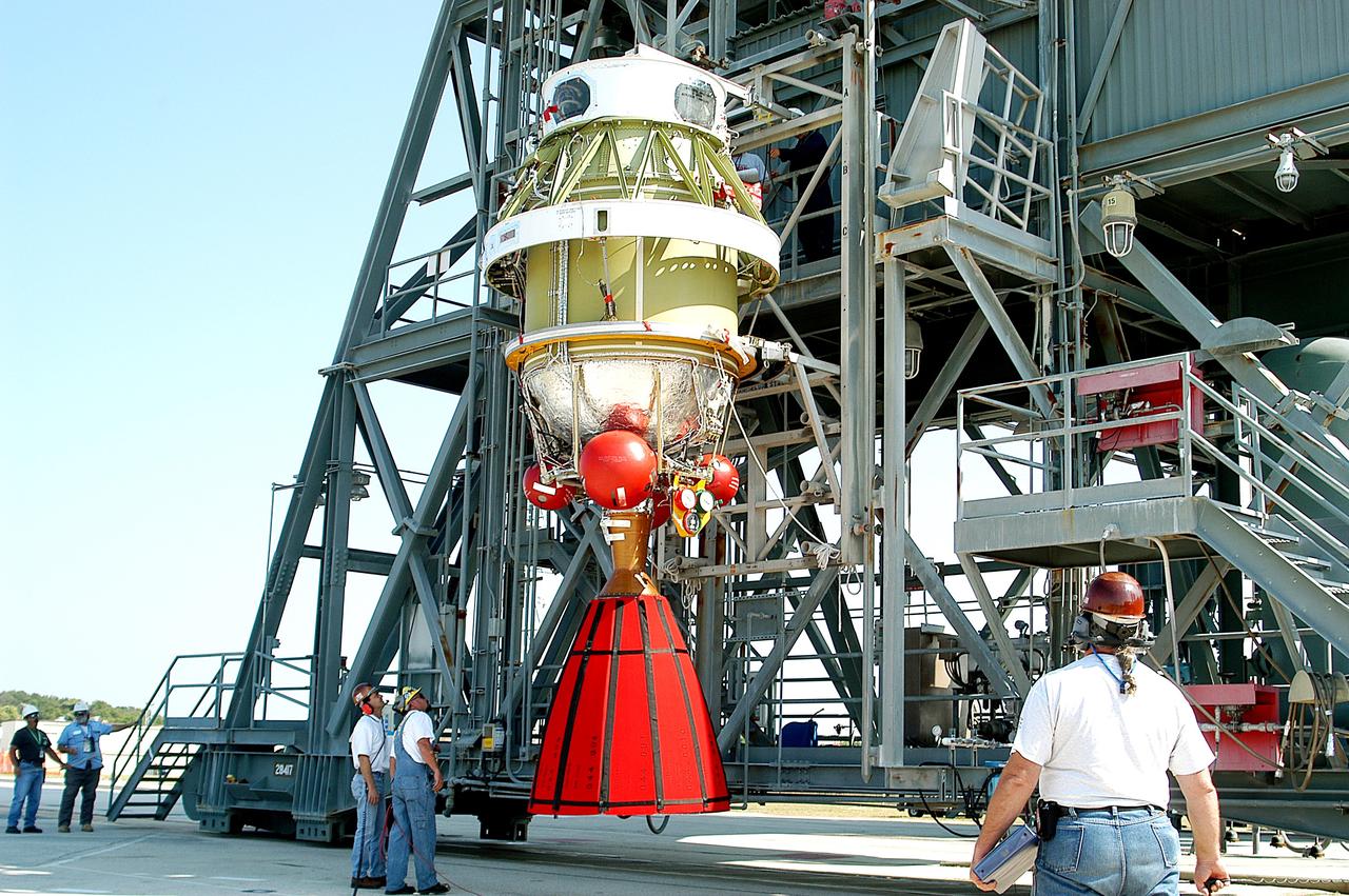 KENNEDY SPACE CENTER, FLA. - The second stage of a Delta II rocket is raised to a vertical position and prepared for its lift up the launch tower on Pad 17-B, Cape Canaveral Air Force Station.  It will be mated to the Delta first stage already at the pad in preparation for the launch of the Mars Exploration Rover-1 (MER-B) on June 25.  NASA’s twin Mars Exploration Rovers are designed to study the history of water on Mars. These robotic geologists are equipped with a robotic arm, a drilling tool, three spectrometers, and four pairs of cameras that allow them to have a human-like, 3D view of the terrain. Each rover could travel as far as 100 meters in one day to act as Mars scientists' eyes and hands, exploring an environment where humans are not yet able to go. The launch of MER-2 (MER-A) is tentatively set for June 8.