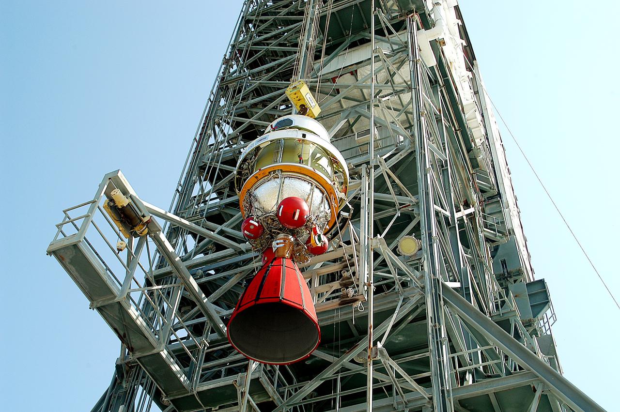 KENNEDY SPACE CENTER, FLA. - The second stage of a Delta II rocket is lifted up the launch tower on Pad 17-B, Cape Canaveral Air Force Station.  It will be mated to the Delta first stage already at the pad in preparation for the launch of the Mars Exploration Rover-1 (MER-B) on June 25.  NASA’s twin Mars Exploration Rovers are designed to study the history of water on Mars. These robotic geologists are equipped with a robotic arm, a drilling tool, three spectrometers, and four pairs of cameras that allow them to have a human-like, 3D view of the terrain. Each rover could travel as far as 100 meters in one day to act as Mars scientists' eyes and hands, exploring an environment where humans are not yet able to go. The launch of MER-2 (MER-A) is tentatively set for June 8.