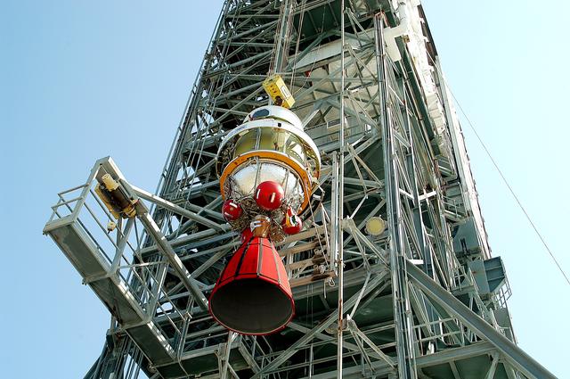 NASA image: KENNEDY SPACE CENTER, FLA. - The second stage of a Delta II rocket is lifted up the launch tower on Pad 17-B, Cape Canaveral Air Force Station.  It will be mated to the Delta first stage already at the pad in preparation for the launch of the Mars Exploration Rover-1 (MER-B) on June 25.  NASA’s twin Mars Exploration Rovers are designed to study the history of water on Mars. These robotic geologists are equipped with a robotic arm, a drilling tool, three spectrometers, and four pairs of cameras that allow them to have a human-like, 3D view of the terrain. Each rover could travel as far as 100 meters in one day to act as Mars scientists' eyes and hands, exploring an environment where humans are not yet able to go. The launch of MER-2 (MER-A) is tentatively set for June 8.