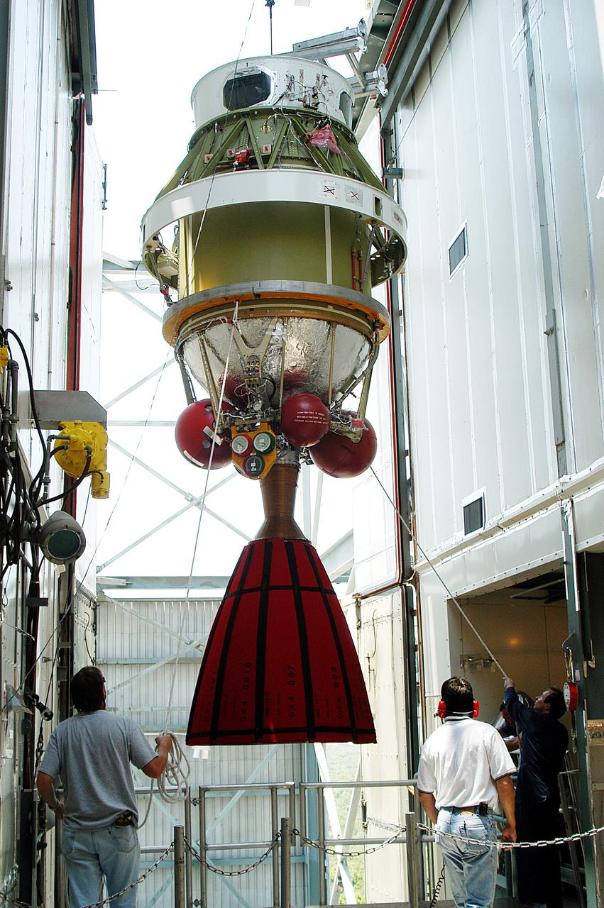 KENNEDY SPACE CENTER, FLA. - The second stage of a Delta II rocket is moved into position at the top of the launch tower on Pad 17-B, Cape Canaveral Air Force Station.  It will be mated to the Delta first stage already at the pad in preparation for the launch of the Mars Exploration Rover-1 (MER-B) on June 25.  NASA’s twin Mars Exploration Rovers are designed to study the history of water on Mars. These robotic geologists are equipped with a robotic arm, a drilling tool, three spectrometers, and four pairs of cameras that allow them to have a human-like, 3D view of the terrain. Each rover could travel as far as 100 meters in one day to act as Mars scientists' eyes and hands, exploring an environment where humans are not yet able to go. The launch of MER-2 (MER-A) is tentatively set for June 8.
