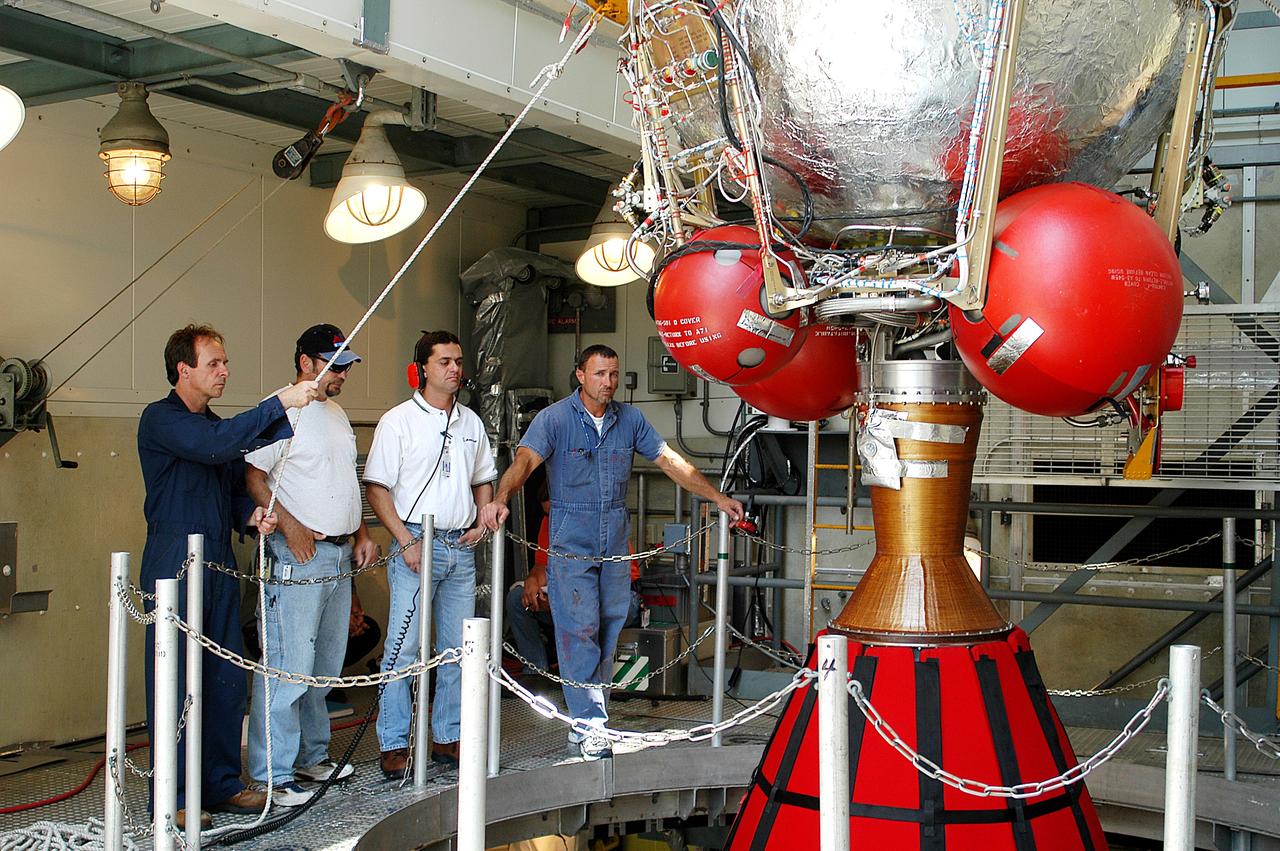 KENNEDY SPACE CENTER, FLA. - The second stage of a Delta II rocket is positioned above a first stage at the top of the launch tower on Pad 17-B, Cape Canaveral Air Force Station. Next, it will be mated to the first stage in preparation for the launch of the Mars Exploration Rover-1 (MER-B) on June 25.  NASA’s twin Mars Exploration Rovers are designed to study the history of water on Mars. These robotic geologists are equipped with a robotic arm, a drilling tool, three spectrometers, and four pairs of cameras that allow them to have a human-like, 3D view of the terrain. Each rover could travel as far as 100 meters in one day to act as Mars scientists' eyes and hands, exploring an environment where humans are not yet able to go. The launch of MER-2 (MER-A) is tentatively set for June 8.