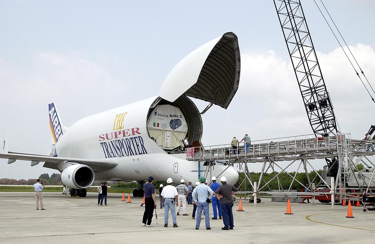 KENNEDY SPACE CENTER, FLA. - The Italian-built module, U.S. Node 2, for the International Space Station is offloaded from a Beluga at the Shuttle Landing Facility. The second of three Station connecting modules, Node 2 attaches to the end of the U.S. Lab and provides attach locations for the Japanese laboratory, European laboratory, the Centrifuge Accommodation Module and, later, Multipurpose Logistics Modules. It will provide the primary docking location for the Shuttle when a pressurized mating adapter is attached to Node 2.  Installation of the module will complete  the U.S. Core of the ISS.  Node 2 is the designated payload for mission STS-120.  No orbiter or launch date has been determined yet.