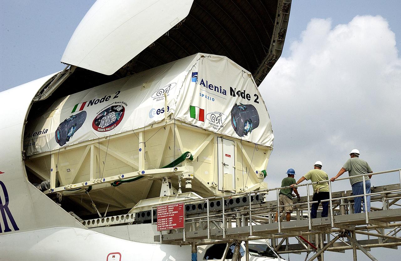 KENNEDY SPACE CENTER, FLA. - The Italian-built module, U.S. Node 2, for the International Space Station is offloaded from a Beluga aircraft at the Shuttle Landing Facility. The second of three Station connecting modules, Node 2 attaches to the end of the U.S. Lab and provides attach locations for the Japanese laboratory, European laboratory, the Centrifuge Accommodation Module and, later, Multipurpose Logistics Modules. It will provide the primary docking location for the Shuttle when a pressurized mating adapter is attached to Node 2.  Installation of the module will complete  the U.S. Core of the ISS.  Node 2 is the designated payload for mission STS-120.  No orbiter or launch date has been determined yet.