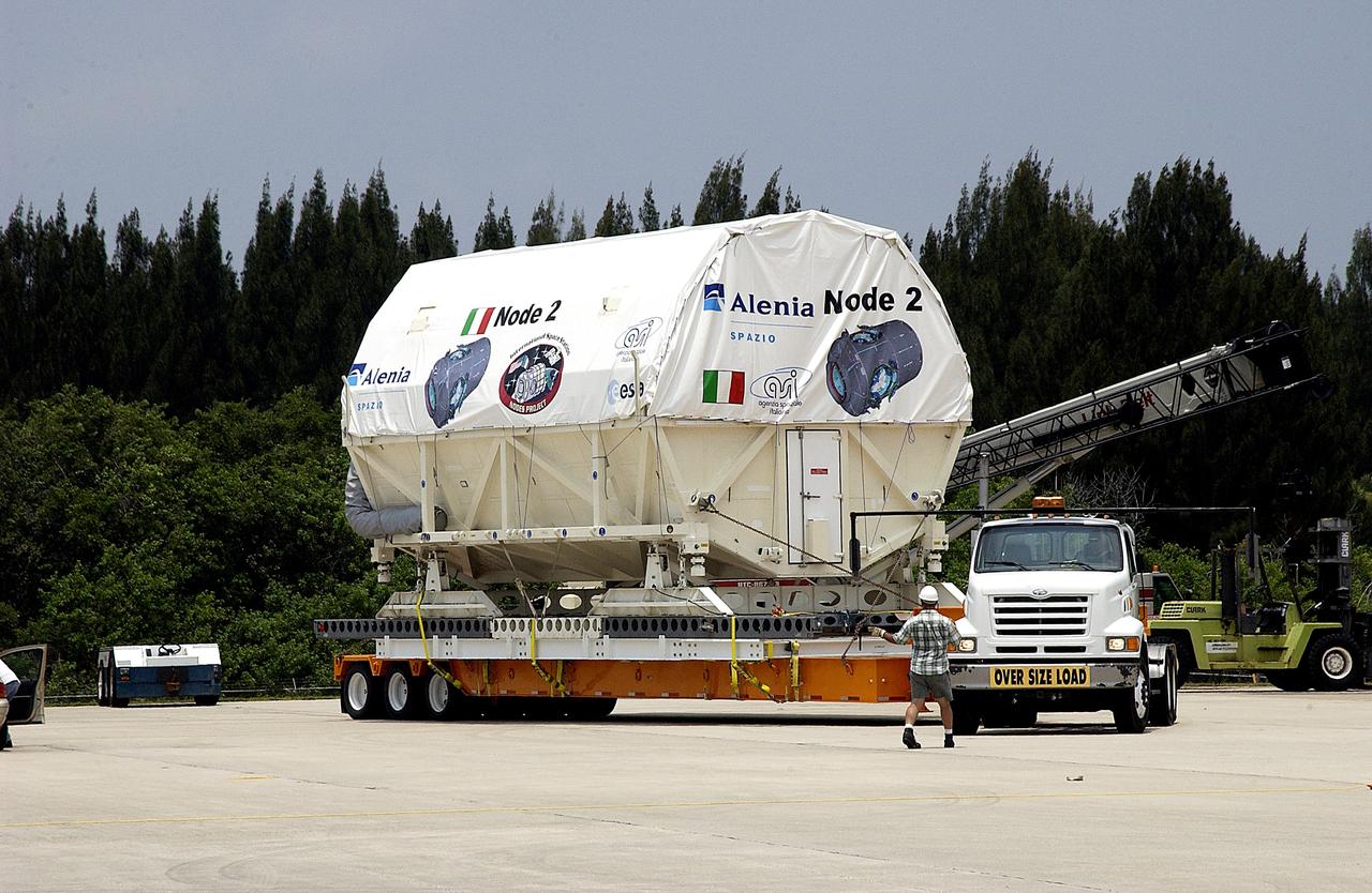 KENNEDY SPACE CENTER, FLA. -  The Italian-built module, U.S. Node 2, begins its transfer from  the Shuttle Landing Facility to the Space Station Processing Facility.  The second of three connecting modules on the International Space Station, Node 2 attaches to the end of the U.S. Lab and provides attach locations for the Japanese laboratory, European laboratory, the Centrifuge Accommodation Module and, later, Multipurpose Logistics Modules. It will provide the primary docking location for the Shuttle when a pressurized mating adapter is attached to Node 2.  Installation of the module will complete  the U.S. Core of the ISS.  Node 2 is the designated payload for mission STS-120.  No orbiter or launch date has been determined yet.
