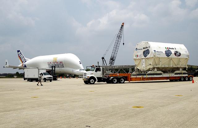 NASA image: KENNEDY SPACE CENTER, FLA. -  The Italian-built module, U.S. Node 2, begins its transfer from  the Shuttle Landing Facility to the Space Station Processing Facility.  Inthe background, left, is the Beluga aircraft that brought it to KSC.  The second of three connecting modules on the International Space Station, Node 2 attaches to the end of the U.S. Lab and provides attach locations for the Japanese laboratory, European laboratory, the Centrifuge Accommodation Module and, later, Multipurpose Logistics Modules. It will provide the primary docking location for the Shuttle when a pressurized mating adapter is attached to Node 2.  Installation of the module will complete  the U.S. Core of the ISS.  Node 2 is the designated payload for mission STS-120.  No orbiter or launch date has been determined yet.