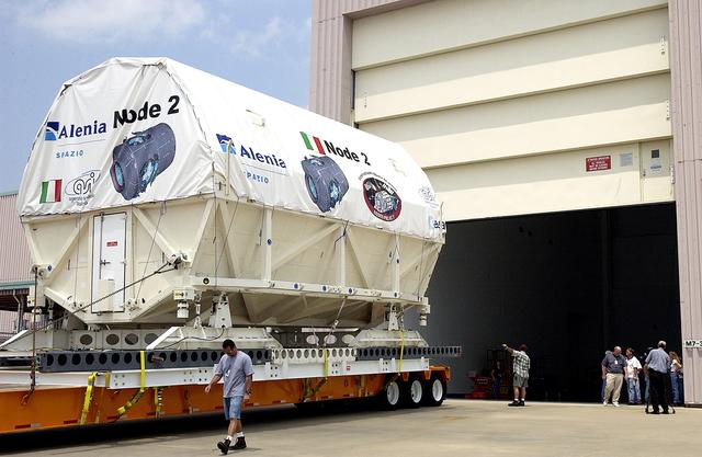 NASA image: KENNEDY SPACE CENTER, FLA. -  The Italian-built module, U.S. Node 2, waits at the Space Station Processing Facility for the door to open. The second of three connecting modules on the International Space Station, Node 2 attaches to the end of the U.S. Lab and provides attach locations for the Japanese laboratory, European laboratory, the Centrifuge Accommodation Module and, later, Multipurpose Logistics Modules. It will provide the primary docking location for the Shuttle when a pressurized mating adapter is attached to Node 2.  Installation of the module will complete  the U.S. Core of the ISS.  Node 2 is the designated payload for mission STS-120.  No orbiter or launch date has been determined yet.