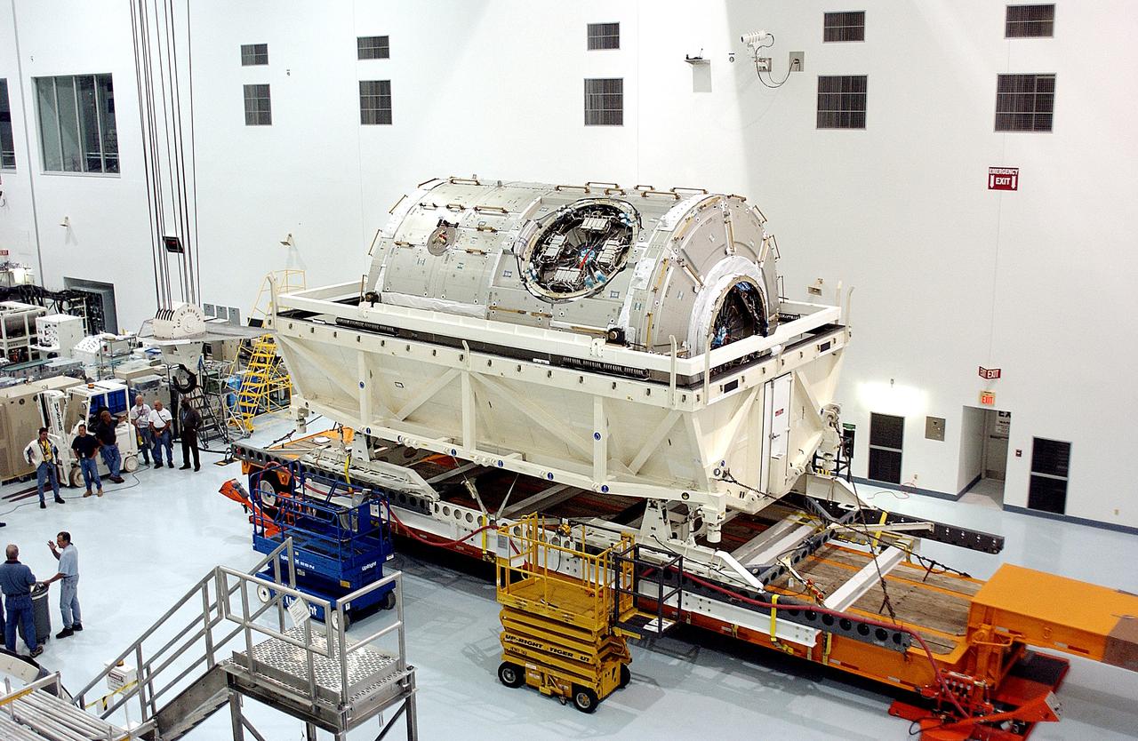 KENNEDY SPACE CENTER, FLA. - The U.S. Node 2 is unveiled after its arrival in the Space Station Processing Facility.  The second of three Station connecting modules, the Italian-built Node 2 attaches to the end of the U.S. Lab and provides attach locations for the Japanese laboratory, European laboratory, the Centrifuge Accommodation Module and, later, Multipurpose Logistics Modules. It will provide the primary docking location for the Shuttle when a pressurized mating adapter is attached to Node 2.  Installation of the module will complete  the U.S. Core of the ISS.  Node 2 is the designated payload for mission STS-120.  No orbiter or launch date has been determined yet.