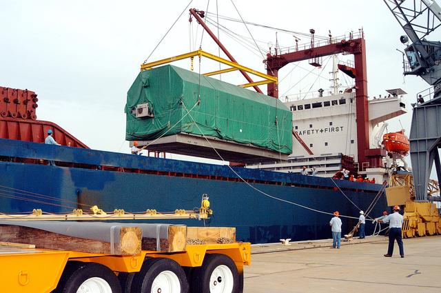 NASA image: KENNEDY SPACE CENTER, FLA. - At Port Canaveral, the Pressurized Module of the Japanese Experiment Module (JEM) is swung away from the ship. The container transport ship carrying JEM departed May 2 from Yokohama Harbor in Japan for the voyage to the United States. The National Space Development Agency of Japan (NASDA) developed the laboratory at the Tsukuba Space Center near Tokyo.  The module will be loaded onto a truck bed and transferred to KSC’s Space Station Processing Facility.  The Pressurized Module is the first element of the JEM, named "Kibo" (Hope), to be delivered to KSC. The JEM is Japan's primary contribution to the Station. It will enhance the unique research capabilities of the orbiting complex by providing an additional environment for astronauts to conduct science experiments.  The JEM also includes an exposed facility (platform) for space environment experiments, a robotic manipulator system, and two logistics modules. The various JEM components will be  assembled in space over the course of three Shuttle missions.