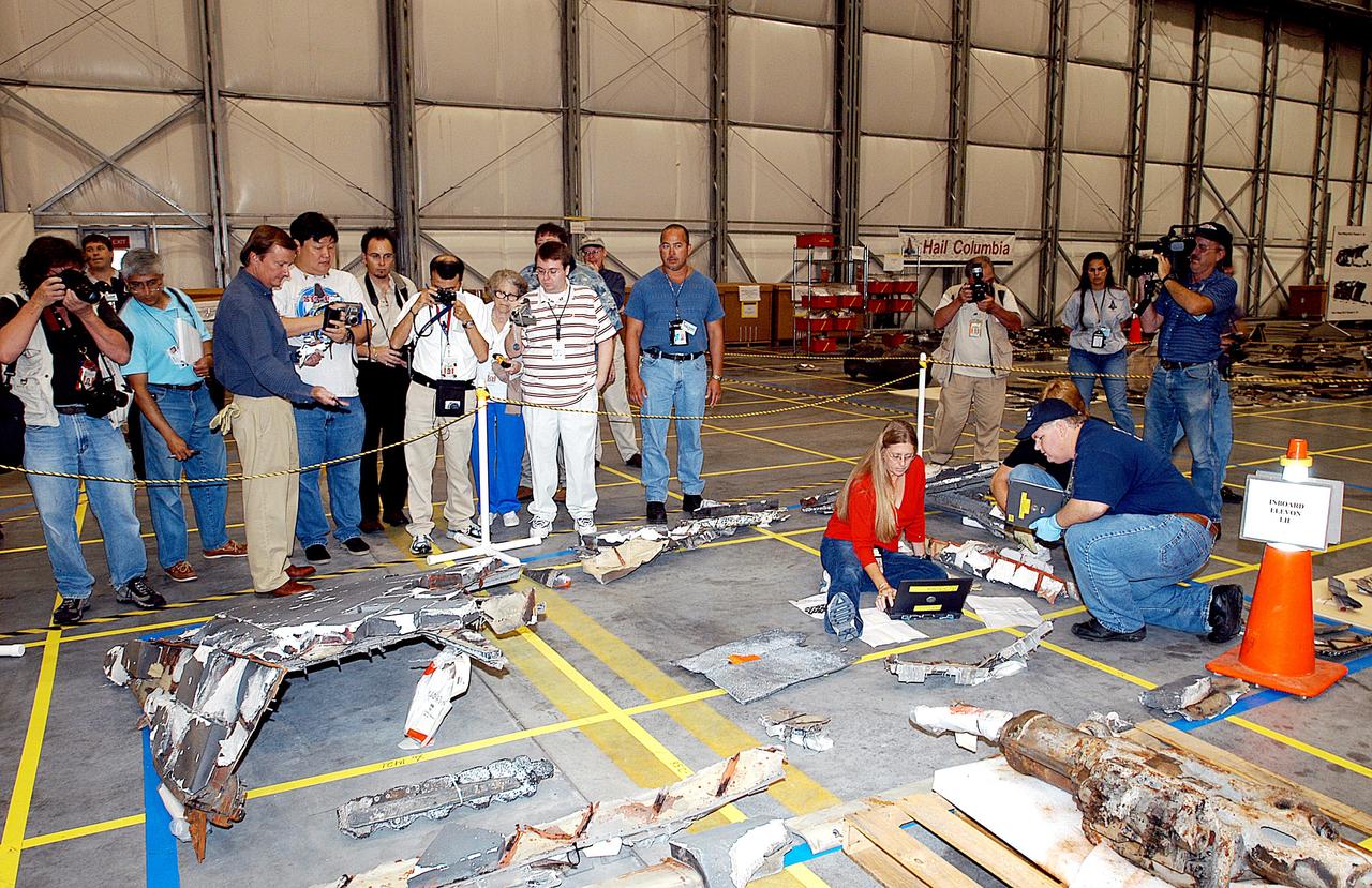 KENNEDY SPACE CENTER, FLA. - The media get a guided tour of the Columbia Debris Hangar.  Shuttle Launch Director Mike Leinbach discussed activities that have taken place since the Columbia accident on Feb. 1, 2003.  STS-107 debris recovery and reconstruction operations are winding down.  To date, nearly 84,000 pieces of debris have been recovered and sent to KSC. That represents about 38 percent of the dry weight of Columbia, equaling almost 85,000 pounds.