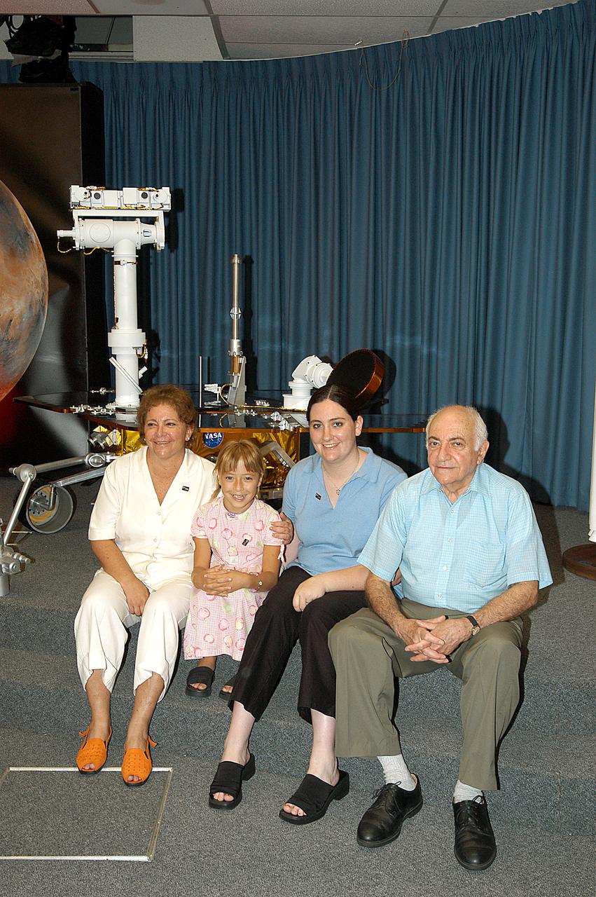 Siberian-born Sofi Collis (second from left), the third grade student winner of the "Name the Rovers" contest, poses with her adopted American family. The names she proposed -- Spirit and Opportunity -- were announced today in a press conference held by NASA Administrator Sean O'Keefe. NASA's twin Mars Exploration Rovers are designed to study the history of water on Mars. These robotic geologists are equipped with a robotic arm, a drilling tool, three spectrometers, and four pairs of cameras that allow them to have a human-like, 3D view of the terrain. Each rover could travel as far as 100 meters in one day to act as Mars scientists' eyes and hands, exploring an environment where humans are not yet able to go. MER-A, with the rover Spirit aboard, is scheduled to launch on June 8 at 2:06 p.m. EDT, with two launch opportunities each day during a launch period that closes on June 24.