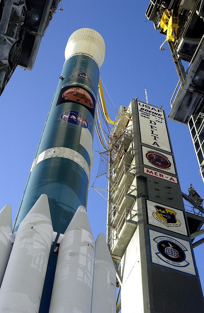 KENNEDY SPACE CENTER, FLA. -  The Mobile Service Tower is rolled back at Launch Complex 17A to reveal a Delta II rocket ready to launch the Mars Exploration Rover-A mission.  NASA's twin Mars Exploration Rovers are designed to study the history of water on Mars. These robotic geologists are equipped with a robotic arm, a drilling tool, three spectrometers, and four pairs of cameras that allow them to have a human-like, 3D view of the terrain. Each rover could travel as far as 100 meters in one day to act as Mars scientists' eyes and hands, exploring an environment where humans are not yet able to go. MER-A, with the rover Spirit aboard, is scheduled to launch on June 8 at 2:06 p.m. EDT, with two launch opportunities each day during a launch period that closes on June 24.