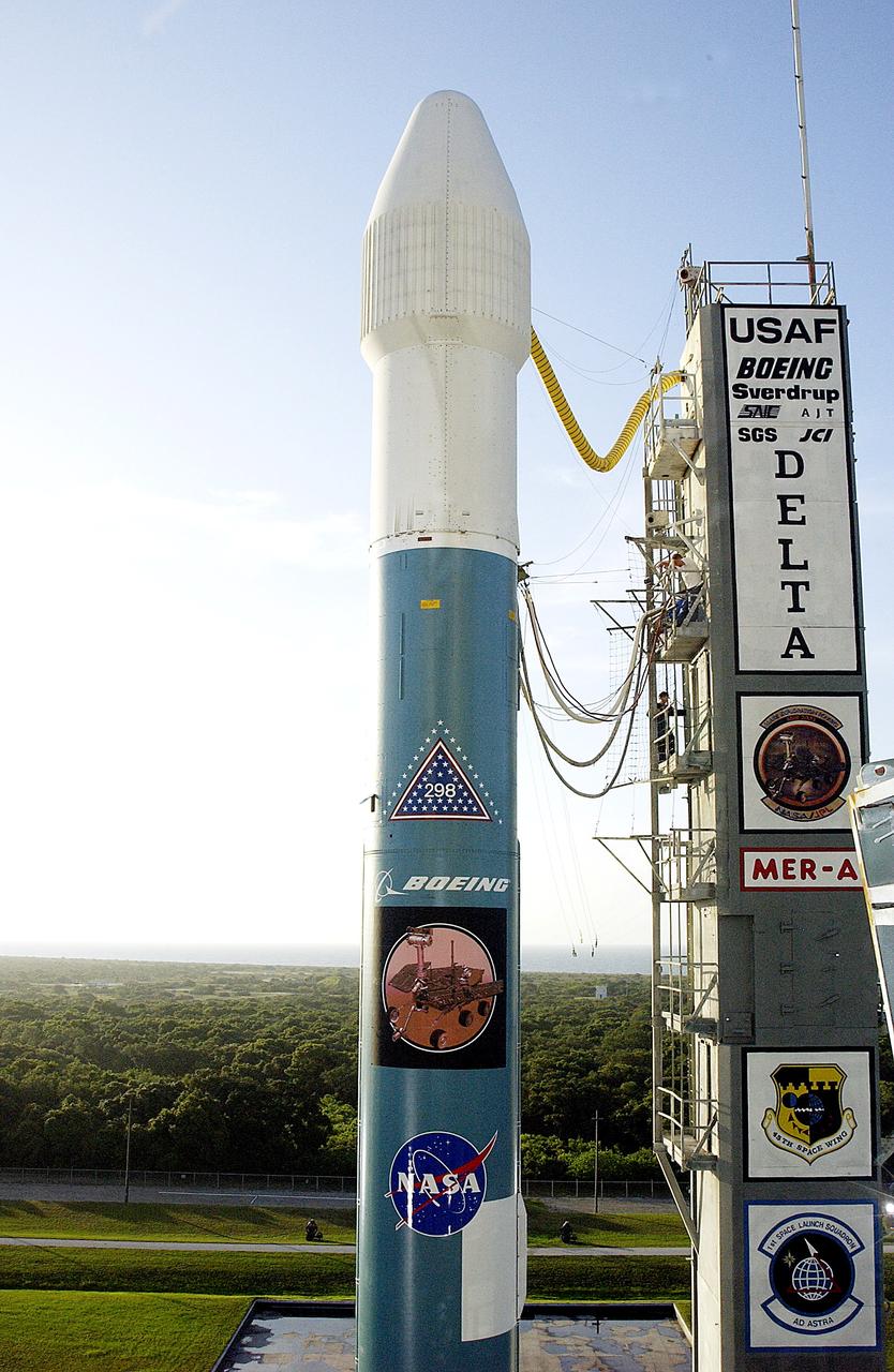 KENNEDY SPACE CENTER, FLA. -  The Mobile Service Tower is rolled back at Launch Complex 17A to reveal a Delta II rocket ready to launch the Mars Exploration Rover-A mission.  NASA's twin Mars Exploration Rovers are designed to study the history of water on Mars. These robotic geologists are equipped with a robotic arm, a drilling tool, three spectrometers, and four pairs of cameras that allow them to have a human-like, 3D view of the terrain. Each rover could travel as far as 100 meters in one day to act as Mars scientists' eyes and hands, exploring an environment where humans are not yet able to go. MER-A, with the rover Spirit aboard, is scheduled to launch on June 8 at 2:06 p.m. EDT, with two launch opportunities each day during a launch period that closes on June 24.