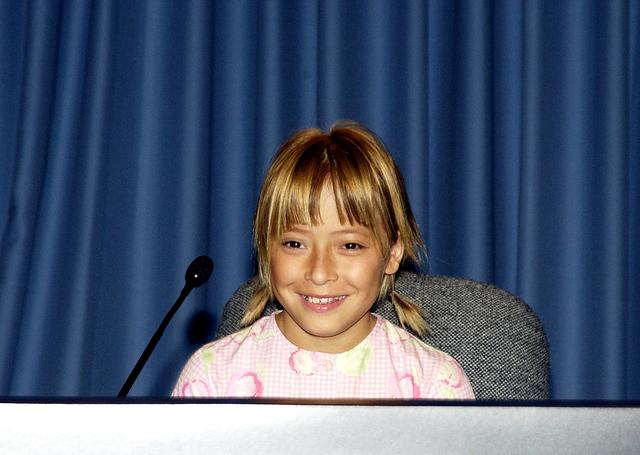 NASA image: KENNEDY SPACE CENTER, FLA. -  Nine-year-old Sofi Collis is introduced to the media at a press conference.   The Siberian-born Arizona resident wrote the winning entry in the Name the Rovers Contest sponsored by NASA and the Lego Co., a Denmark-based toymaker, with collaboration from the Planetary Society, Pasadena, Calif.  The names she selected for the Mars Exploration Rovers are "Spirit" and "Opportunity." The third grader's essay was chosen from more than 10,000 American student entries.  NASA's twin Mars Exploration Rovers are designed to study the history of water on Mars. These robotic geologists are equipped with a robotic arm, a drilling tool, three spectrometers, and four pairs of cameras that allow them to have a human-like, 3D view of the terrain. Each rover could travel as far as 100 meters in one day to act as Mars scientists' eyes and hands, exploring an environment where humans are not yet able to go. MER-A, with the rover Spirit aboard, is scheduled to launch on June 8 at 2:06 p.m. EDT, with two launch opportunities each day during a launch period that closes on June 24.