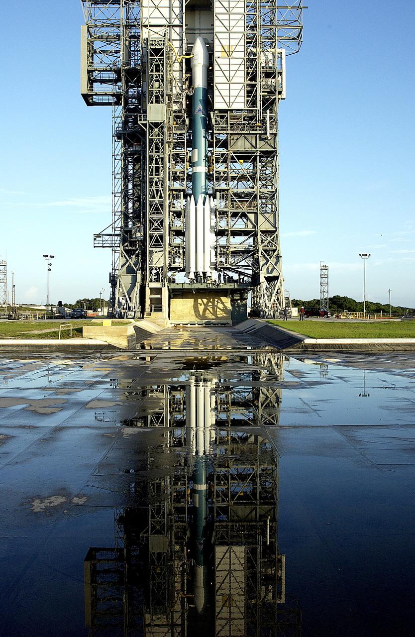 KENNEDY SPACE CENTER, FLA. -  On Launch Complex 17-A, Cape Canaveral Air Force Station, the Boeing Delta II rocket and its Mars Exploration Rover (MER-A) payload waits for rollback of the launch tower in preparation for a second attempt at launch.  The first attempt on June 8, 2003, was scrubbed due to bad weather in the vicinity.  MER-A is the first of two rovers being launched to Mars.  When the two rovers arrive at Mars in 2004, they will bounce to airbag-cushioned landings at sites offering a balance of favorable conditions for safe landings and interesting science. The rovers see sharper images, can explore farther and examine rocks better than anything that has ever landed on Mars.  The designated site for MER-A mission is Gusev Crater, which appears to have been a crater lake.  The second rover, MER-B, is scheduled to launch June 25.