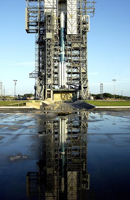 NASA image: KENNEDY SPACE CENTER, FLA. -  On Launch Complex 17-A, Cape Canaveral Air Force Station, the Boeing Delta II rocket and its Mars Exploration Rover (MER-A) payload waits for rollback of the launch tower in preparation for a second attempt at launch.  The first attempt on June 8, 2003, was scrubbed due to bad weather in the vicinity.  MER-A is the first of two rovers being launched to Mars.  When the two rovers arrive at Mars in 2004, they will bounce to airbag-cushioned landings at sites offering a balance of favorable conditions for safe landings and interesting science. The rovers see sharper images, can explore farther and examine rocks better than anything that has ever landed on Mars.  The designated site for MER-A mission is Gusev Crater, which appears to have been a crater lake.  The second rover, MER-B, is scheduled to launch June 25.