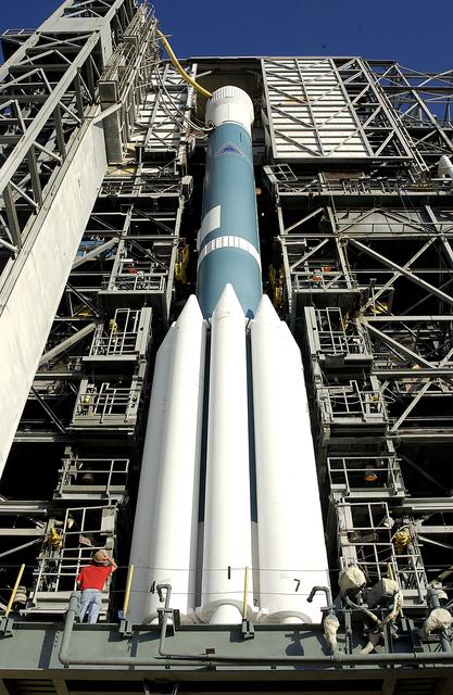 NASA image: KENNEDY SPACE CENTER, FLA. - On Launch Complex 17-A, Cape Canaveral Air Force Station, the launch tower begins to roll back from the Boeing Delta II rocket and its Mars Exploration Rover (MER-A) payload in preparation for a second attempt at launch.  The first attempt on June 8, 2003, was scrubbed due to bad weather in the vicinity.  MER-A is the first of two rovers being launched to Mars.  When the two rovers arrive at Mars in 2004, they will bounce to airbag-cushioned landings at sites offering a balance of favorable conditions for safe landings and interesting science. The rovers see sharper images, can explore farther and examine rocks better than anything that has ever landed on Mars.  The designated site for MER-A mission is Gusev Crater, which appears to have been a crater lake.  The second rover, MER-B, is scheduled to launch June 25.