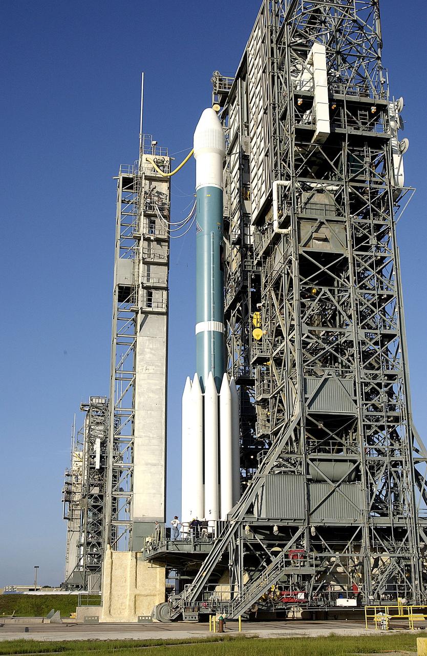 KENNEDY SPACE CENTER, FLA. -  On Launch Complex 17-A, Cape Canaveral Air Force Station, the launch tower begins to roll back from the Boeing Delta II rocket and its Mars Exploration Rover (MER-A) payload in preparation for a second attempt at launch.  The first attempt on June 8, 2003, was scrubbed due to bad weather in the vicinity.  MER-A is the first of two rovers being launched to Mars.  When the two rovers arrive at Mars in 2004, they will bounce to airbag-cushioned landings at sites offering a balance of favorable conditions for safe landings and interesting science. The rovers see sharper images, can explore farther and examine rocks better than anything that has ever landed on Mars.  The designated site for MER-A mission is Gusev Crater, which appears to have been a crater lake.  The second rover, MER-B, is scheduled to launch June 25.