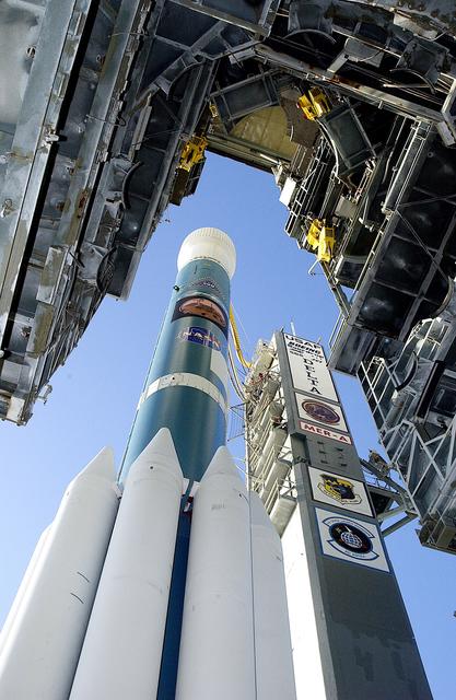 NASA image: KENNEDY SPACE CENTER, FLA. -   The Boeing Delta II rocket and its Mars Exploration Rover (MER-A) payload is viewed from under the launch tower as it moves away on Launch Complex 17-A, Cape Canaveral Air Force Station.  This will be a second attempt at launch.  The first attempt on June 8, 2003, was scrubbed due to bad weather in the vicinity.  MER-A is the first of two rovers being launched to Mars.  When the two rovers arrive at Mars in 2004, they will bounce to airbag-cushioned landings at sites offering a balance of favorable conditions for safe landings and interesting science. The rovers see sharper images, can explore farther and examine rocks better than anything that has ever landed on Mars.  The designated site for MER-A mission is Gusev Crater, which appears to have been a crater lake.  The second rover, MER-B, is scheduled to launch June 25.