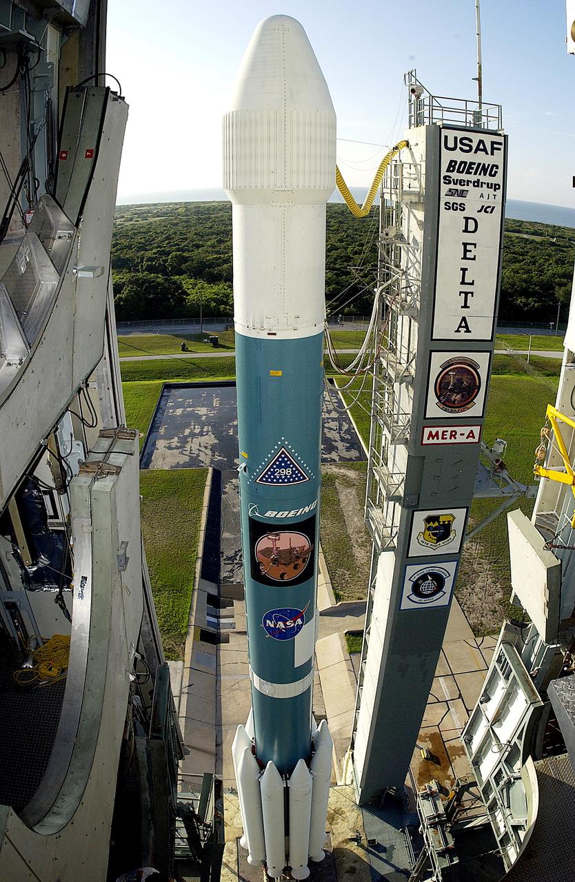 KENNEDY SPACE CENTER, FLA. -    The launch tower on Launch Complex 17-A, Cape Canaveral Air Force Station, clears the Boeing Delta II rocket and its Mars Exploration Rover (MER-A) payload in preparation for a second attempt at launch.  The first attempt on June 8, 2003, was scrubbed due to bad weather in the vicinity.  MER-A is the first of two rovers being launched to Mars.  When the two rovers arrive at Mars in 2004, they will bounce to airbag-cushioned landings at sites offering a balance of favorable conditions for safe landings and interesting science. The rovers see sharper images, can explore farther and examine rocks better than anything that has ever landed on Mars.  The designated site for MER-A mission is Gusev Crater, which appears to have been a crater lake.  The second rover, MER-B, is scheduled to launch June 25.