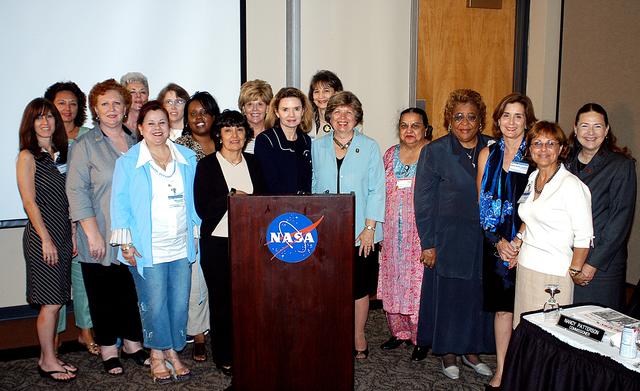 NASA image: KENNEDY SPACE CENTER, FLA. -    KSC External Relations and Business Development Director JoAnn Morgan (sixth from right) joins other attendees of The Florida Commission on the Status of Women held June 7 at the Debus Conference Facility. Morgan is a member of the group’s Hall of Fame. The commission, through coordinating, researching, communicating, and encouraging legislation, is dedicated to empowering women from all walks of life in achieving their fullest potential, to eliminating barriers to that achievement, and to recognizing women’s accomplishments.