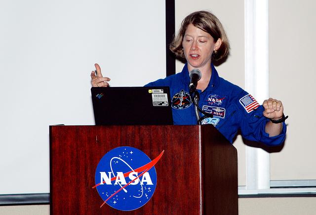 NASA image: KENNEDY SPACE CENTER, FLA. -    At the Florida Commission on the Status of Women held June 7 at the Debus Conference Facility, astronaut Pamela Melroy speaks to attendees.  Melroy has served as pilot on two Shuttle flights (STS-92 in 2000 and STS-112 in 2002), and has logged more than 562 hours in space. The commission, through coordinating, researching, communicating, and encouraging legislation, is dedicated to empowering women from all walks of life in achieving their fullest potential, to eliminating barriers to that achievement, and to recognizing women’s accomplishments.
