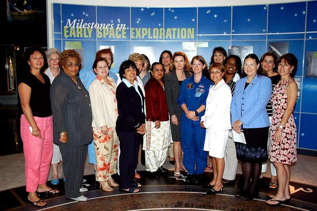 NASA image: KENNEDY SPACE CENTER, FLA. -    Astronaut Pamela Melroy (fourth from right in front) joins other attendees at the Florida Commission on the Status of Women held June 7 at the Debus Conference Facility.  Melroy was a speaker.  Her accomplishments include serving as pilot on two Shuttle flights (STS-92 in 2000 and STS-112 in 2002), and logging more than 562 hours in space.   The commission, through coordinating, researching, communicating, and encouraging legislation, is dedicated to empowering women from all walks of life in achieving their fullest potential, to eliminating barriers to that achievement, and to recognizing women’s accomplishments.