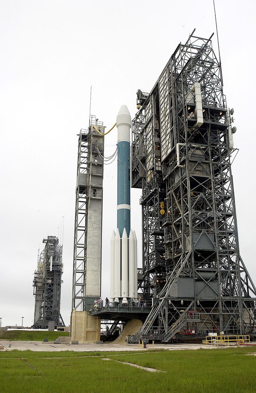 KENNEDY SPACE CENTER, FLA. -   On Launch Complex 17-A, Cape Canaveral Air Force Station, the launch tower rolls back from the Boeing Delta II rocket and its Mars Exploration Rover (MER-A) payload in preparation for another launch attempt.  The first two attempts, June 8 and June 9, were postponed due to weather concerns.  MER-A is the first of two rovers being launched to Mars.  When the two rovers arrive at Mars in 2004, they will bounce to airbag-cushioned landings at sites offering a balance of favorable conditions for safe landings and interesting science. The rovers see sharper images, can explore farther and examine rocks better than anything that has ever landed on Mars.  The designated site for MER-A mission is Gusev Crater, which appears to have been a crater lake.  The second rover, MER-B, is scheduled to launch June 25.
