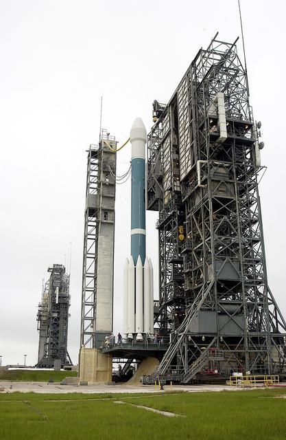 NASA image: KENNEDY SPACE CENTER, FLA. -   On Launch Complex 17-A, Cape Canaveral Air Force Station, the launch tower rolls back from the Boeing Delta II rocket and its Mars Exploration Rover (MER-A) payload in preparation for another launch attempt.  The first two attempts, June 8 and June 9, were postponed due to weather concerns.  MER-A is the first of two rovers being launched to Mars.  When the two rovers arrive at Mars in 2004, they will bounce to airbag-cushioned landings at sites offering a balance of favorable conditions for safe landings and interesting science. The rovers see sharper images, can explore farther and examine rocks better than anything that has ever landed on Mars.  The designated site for MER-A mission is Gusev Crater, which appears to have been a crater lake.  The second rover, MER-B, is scheduled to launch June 25.