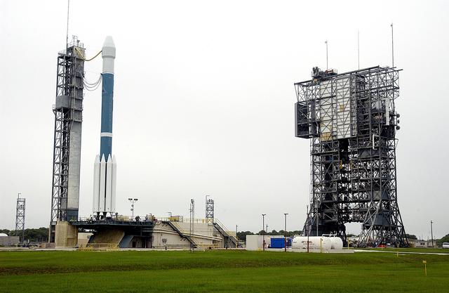 NASA image: KENNEDY SPACE CENTER, FLA. -  On Launch Complex 17-A, Cape Canaveral Air Force Station, the Boeing Delta II rocket and its Mars Exploration Rover (MER-A) payload are free of the tower (right) and ready for launch.  This will be the third launch attempt in as many days after weather concerns postponed the launches June 8 and June 9.  MER-A is the first of two rovers being launched to Mars.  When the two rovers arrive at Mars in 2004, they will bounce to airbag-cushioned landings at sites offering a balance of favorable conditions for safe landings and interesting science. The rovers see sharper images, can explore farther and examine rocks better than anything that has ever landed on Mars.  The designated site for MER-A mission is Gusev Crater, which appears to have been a crater lake.  The second rover, MER-B, is scheduled to launch June 25.
