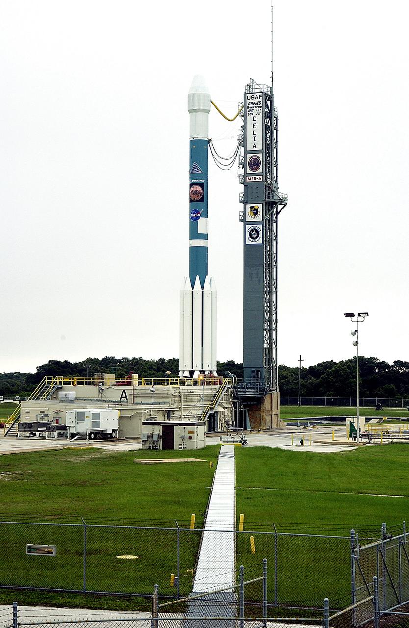 KENNEDY SPACE CENTER, FLA. -  On Launch Complex 17-A, Cape Canaveral Air Force Station, the Boeing Delta II rocket and its Mars Exploration Rover (MER-A) payload are free of the tower  and ready for launch.  This will be the third launch attempt in as many days after weather concerns postponed the launches June 8 and June 9.  MER-A is the first of two rovers being launched to Mars.  When the two rovers arrive at the red planet in 2004, they will bounce to airbag-cushioned landings at sites offering a balance of favorable conditions for safe landings and interesting science. The rovers see sharper images, can explore farther and examine rocks better than anything that has ever landed on Mars.  The designated site for MER-A mission is Gusev Crater, which appears to have been a crater lake.  The second rover, MER-B, is scheduled to launch June 25.