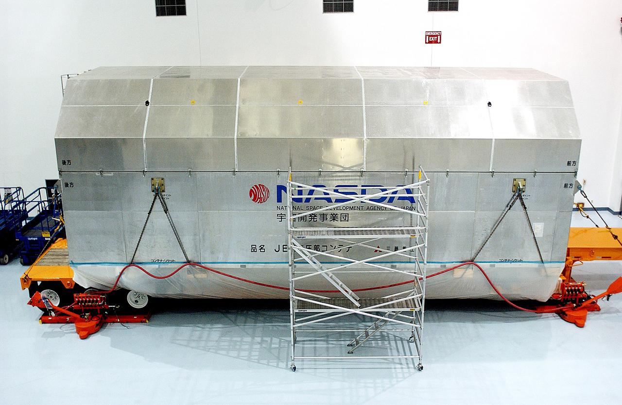KENNEDY SPACE CENTER, FLA. - The container with the Japanese Experiment Module (JEM)’s pressurized module is inside the Space Station Processing Facility.  The National Space Development Agency of Japan (NASDA) developed the laboratory at the Tsukuba Space Center near Tokyo. The Pressurized Module is the first element of the JEM, named "Kibo" (Hope), to be delivered to KSC. The JEM is Japan's primary contribution to the Station. It will enhance the unique research capabilities of the orbiting complex by providing an additional environment for astronauts to conduct science experiments.  The JEM also includes an exposed facility (platform) for space environment experiments, a robotic manipulator system, and two logistics modules. The various JEM components will be  assembled in space over the course of three Shuttle missions.