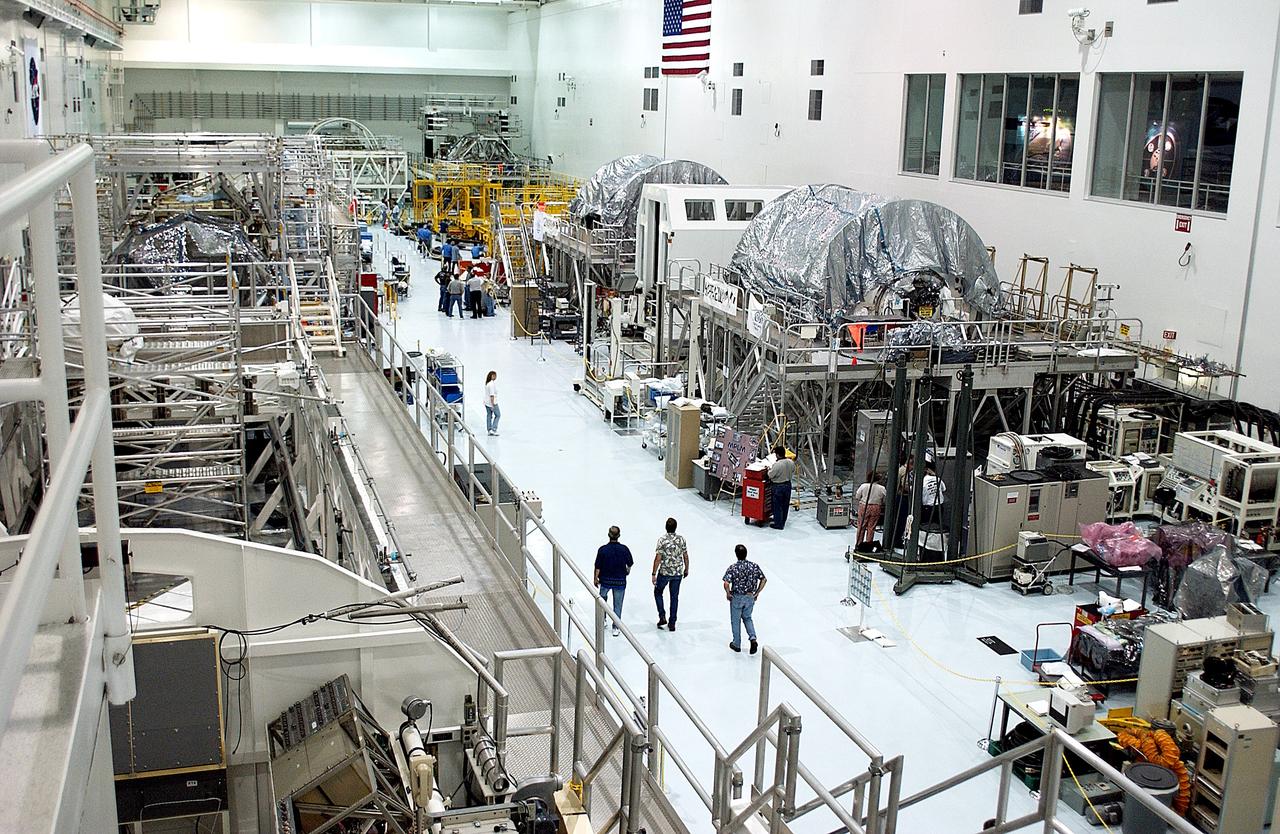 KENNEDY SPACE CENTER, FLA. - An overview of the Space Station Processing Facility shows workstands and ISS elements.   The most recent additions are the Japanese Experiment Module (JEM)’s pressurized module and the Italian-built Node 2.  The pressurized module is the first element of the JEM, Japan’s primary contribution to the Space Station, to be delivered to KSC. It will enhance the unique research capabilities of the orbiting complex by providing an additional shirt-sleeve environment for astronauts to conduct science experiments.  Node 2 will be installed on the end of the U.S. Lab and provides attach locations for the Japanese laboratory, European laboratory, the Centrifuge Accommodation Module and, later, Multipurpose Logistics Modules. It will provide the primary docking location for the Shuttle when a pressurized mating adapter is attached to Node 2.  Installation of the module will complete  the U.S. Core of the ISS.