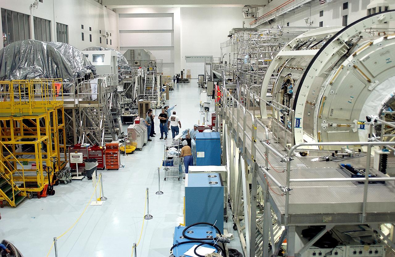 KENNEDY SPACE CENTER, FLA. - A view of the Space Station Processing Facility shows workstands and ISS elements.   The most recent additions are the Japanese Experiment Module (JEM)’s pressurized module and the Italian-built Node 2.  The pressurized module is the first element of the JEM, Japan’s primary contribution to the Space Station, to be delivered to KSC. It will enhance the unique research capabilities of the orbiting complex by providing an additional shirt-sleeve environment for astronauts to conduct science experiments.  Node 2 will be installed on the end of the U.S. Lab and provides attach locations for the Japanese laboratory, European laboratory, the Centrifuge Accommodation Module and, later, Multipurpose Logistics Modules. It will provide the primary docking location for the Shuttle when a pressurized mating adapter is attached to Node 2.  Installation of the module will complete  the U.S. Core of the ISS.