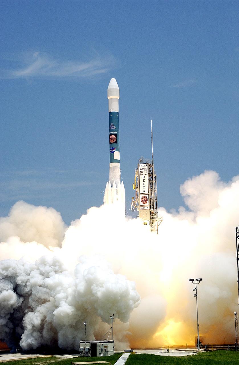 KENNEDY SPACE CENTER, FLA. -  With smoke and steam billowing beneath, the Delta II rocket with its Mars Exploration Rover (MER-A) payload leaps off the launch pad into the blue sky to begin its journey to Mars.  Liftoff occurred on time at 1:58 p.m. EDT from Launch Complex 17-A, Cape Canaveral Air Force Station.  MER-A, known as "Spirit," is the first of two rovers being launched to Mars. When the two rovers arrive at the red planet in 2004, they will bounce to airbag-cushioned landings at sites offering a balance of favorable conditions for safe landings and interesting science. The rovers see sharper images, can explore farther and examine rocks better than anything that has ever landed on Mars. The designated site for the MER-A mission is Gusev Crater, which appears to have been a crater lake. The second rover, MER-B, is scheduled to launch June 25.