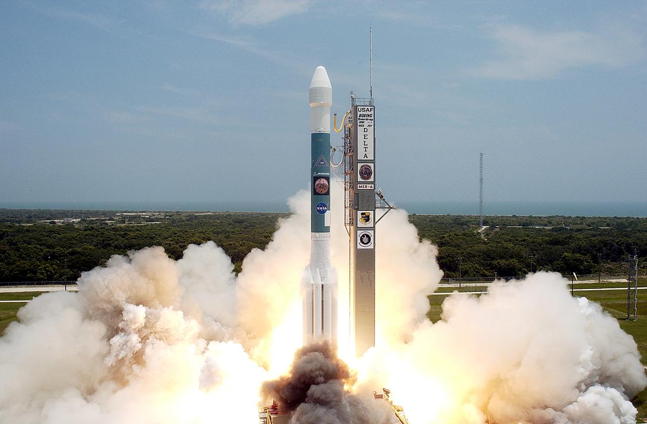 KENNEDY SPACE CENTER, FLA. -   With a glimpse of the Atlantic Ocean over the horizon, the Delta II rocket with its Mars Exploration Rover (MER-A) payload leaps off the launch pad into the blue sky to begin its journey to Mars.  Liftoff occurred on time at 1:58 p.m. EDT from Launch Complex 17-A, Cape Canaveral Air Force Station.  MER-A, known as "Spirit," is the first of two rovers being launched to Mars. When the two rovers arrive at the red planet in 2004, they will bounce to airbag-cushioned landings at sites offering a balance of favorable conditions for safe landings and interesting science. The rovers see sharper images, can explore farther and examine rocks better than anything that has ever landed on Mars. The designated site for the MER-A mission is Gusev Crater, which appears to have been a crater lake. The second rover, MER-B, is scheduled to launch June 25