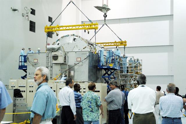NASA image: KENNEDY SPACE CENTER, FLA. -  In the Space Station Processing Facility, the Japanese Experiment Module (JEM) pressure module is ready to be lifted out of the shipping canister and transferred to a work stand.  A research laboratory, the pressurized module is the first element of the JEM, named "Kibo" (Hope), to be delivered to KSC.   The National Space Development Agency of Japan (NASDA) developed the laboratory at the Tsukuba Space Center near Tokyo and is Japan's primary contribution to the Station. It will enhance the unique research capabilities of the orbiting complex by providing an additional environment for astronauts to conduct science experiments.  The JEM also includes an exposed facility (platform) for space environment experiments, a robotic manipulator system, and two logistics modules. The various JEM components will be  assembled in space over the course of three Shuttle missions.