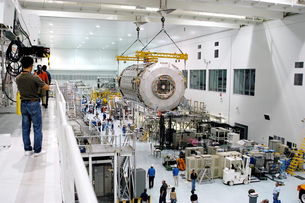 KENNEDY SPACE CENTER, FLA. -   Removed from its shipping canister, the Japanese Experiment Module (JEM) pressure module is moved across the floor of the Space Station Processing Facility to a work stand.  A research laboratory, the pressurized module is the first element of the JEM, named "Kibo" (Hope), to be delivered to KSC.   The National Space Development Agency of Japan (NASDA) developed the laboratory at the Tsukuba Space Center near Tokyo and is Japan's primary contribution to the Station. It will enhance the unique research capabilities of the orbiting complex by providing an additional environment for astronauts to conduct science experiments.  The JEM also includes an exposed facility (platform) for space environment experiments, a robotic manipulator system, and two logistics modules. The various JEM components will be  assembled in space over the course of three Shuttle missions.