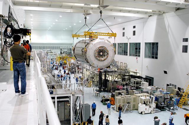 NASA image: KENNEDY SPACE CENTER, FLA. -   Removed from its shipping canister, the Japanese Experiment Module (JEM) pressure module is moved across the floor of the Space Station Processing Facility to a work stand.  A research laboratory, the pressurized module is the first element of the JEM, named "Kibo" (Hope), to be delivered to KSC.   The National Space Development Agency of Japan (NASDA) developed the laboratory at the Tsukuba Space Center near Tokyo and is Japan's primary contribution to the Station. It will enhance the unique research capabilities of the orbiting complex by providing an additional environment for astronauts to conduct science experiments.  The JEM also includes an exposed facility (platform) for space environment experiments, a robotic manipulator system, and two logistics modules. The various JEM components will be  assembled in space over the course of three Shuttle missions.