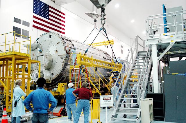 NASA image: KENNEDY SPACE CENTER, FLA. - In the Space Station Processing Facility, overhead cranes are removed from the Japanese Experiment Module (JEM) pressure module now on its work stand.  A research laboratory, the pressurized module is the first element of the JEM, named "Kibo" (Hope), to be delivered to KSC.   The National Space Development Agency of Japan (NASDA) developed the laboratory at the Tsukuba Space Center near Tokyo and is Japan's primary contribution to the Station. It will enhance the unique research capabilities of the orbiting complex by providing an additional environment for astronauts to conduct science experiments.  The JEM also includes an exposed facility (platform) for space environment experiments, a robotic manipulator system, and two logistics modules. The various JEM components will be  assembled in space over the course of three Shuttle missions.